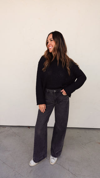 Full body view of Black Ribbed Knit Slouchy Sweater with black denim and sneakers- COCO The Shop