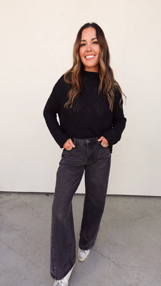 Front view of Black Ribbed Knit Slouchy Sweater with black denim- COCO The Shop