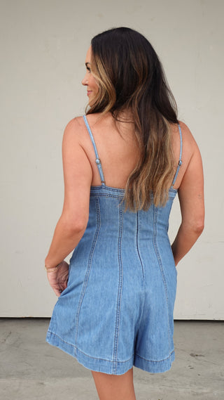 Back view of the Paneled Denim Romper, denim one-piece outfit from COCO The Shop Columbus Ohio boutique