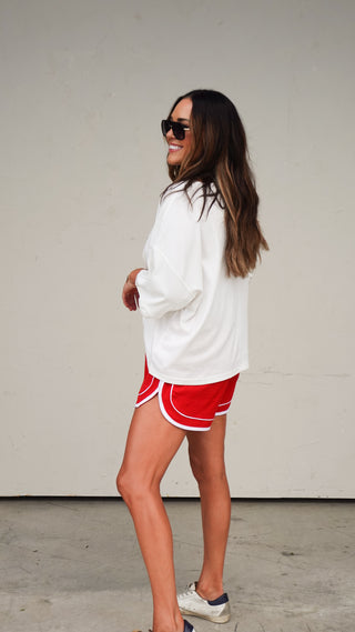 Full length shot of the White Button-Front Short Sleeve Top, women's wardrobe essential from COCO The Shop Columbus Ohio