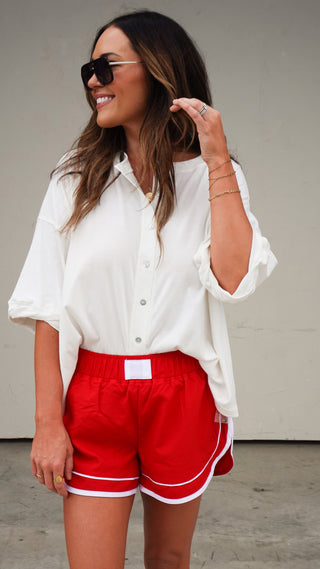 Back view of the White Button-Front Short Sleeve Top, women's classic top from COCO The Shop Dublin Ohio boutique