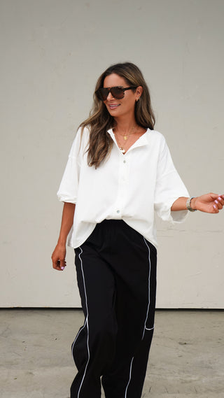 Full length shot of the Black Nylon Track Pants, women's athleisure from COCO The Shop Columbus Ohio
