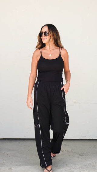Close-up of the Black Nylon Track Pants sleek fabric, women's joggers from COCO The Shop Dublin Ohio boutique
