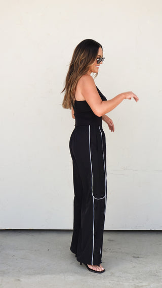 Side view of the Black Nylon Track Pants polished silhouette from COCO The Shop boutique Columbus Ohio
