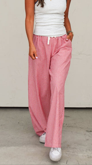 Woman wearing the Red Striped Drawstring Pant, a bold women's statement pant from COCO The Shop Dublin Ohio