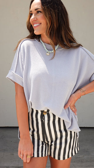 Woman in Dublin Ohio wearing gray raised ribbed tee from COCO The Shop women's boutique