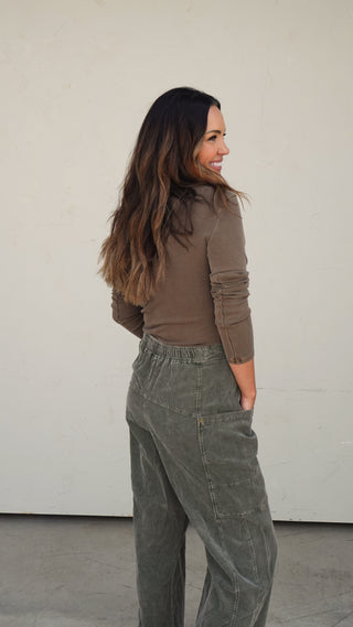 Women's brown ribbed button-front knit top with fitted silhouette